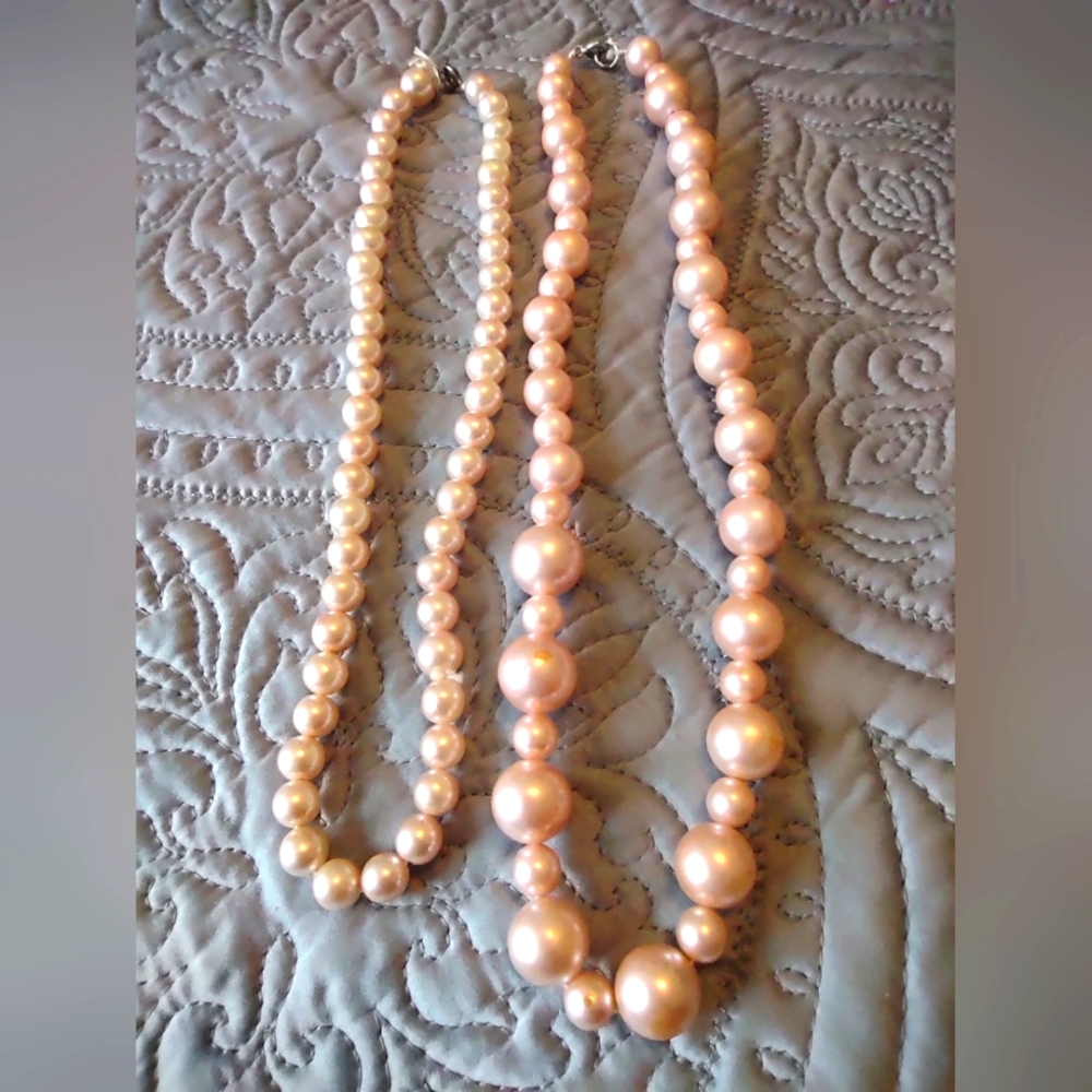 Two strands of Vintage Faux Pink Pearls.